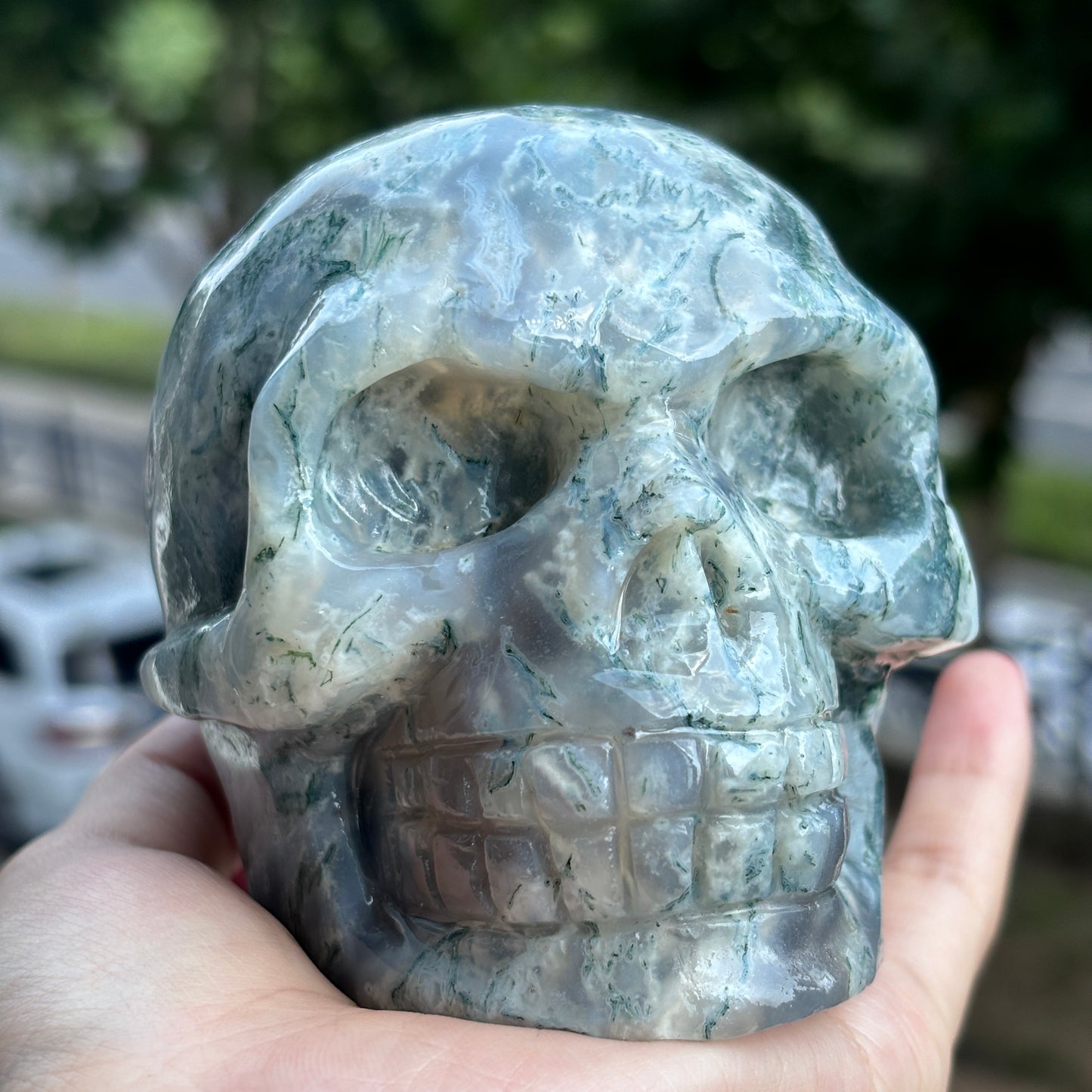 "Handcrafted Moss Agate Skull - Mystical and Delicate Crystal Carving"