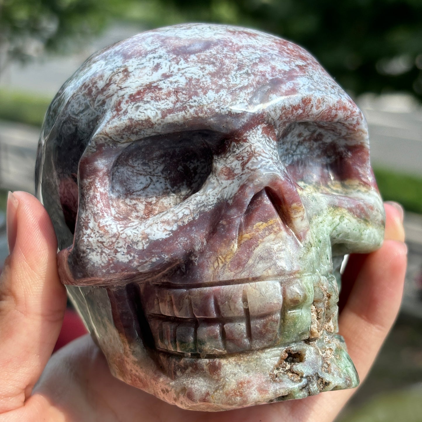 "Handcrafted Moss Agate Skull - Mystical and Delicate Crystal Carving"