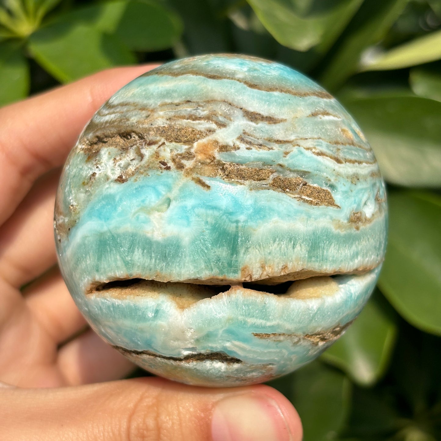 "Hand-carved Hemimorphite spheres - natural stone with unique patterns"