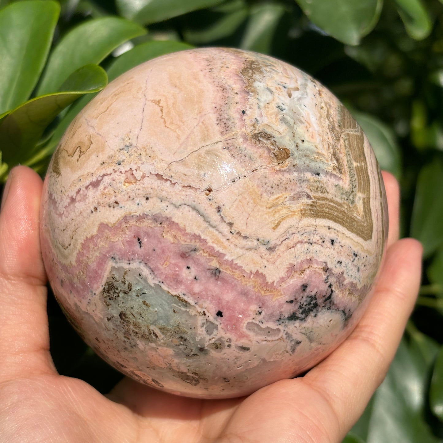 "Natural Rhodonite Crystal Sphere – Harmonious Pink Elegance"