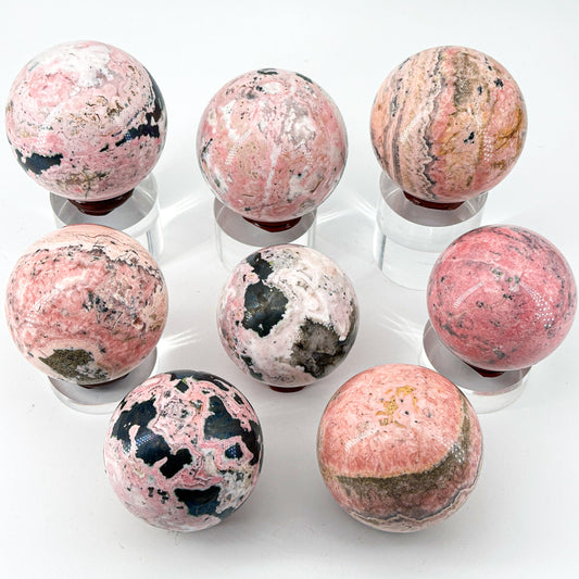 "Natural Rhodonite Crystal Sphere – Harmonious Pink Elegance"