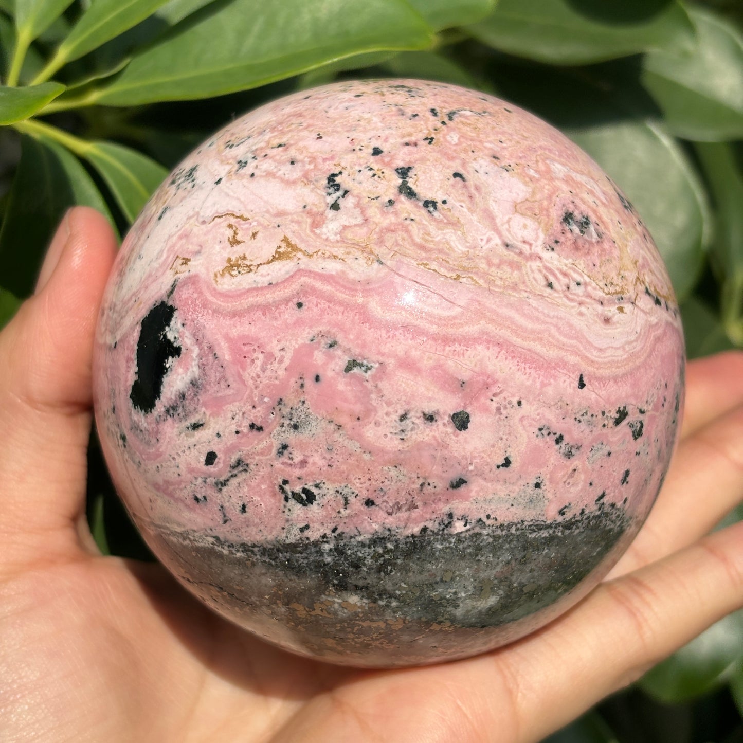 "Natural Rhodonite Crystal Sphere – Harmonious Pink Elegance"